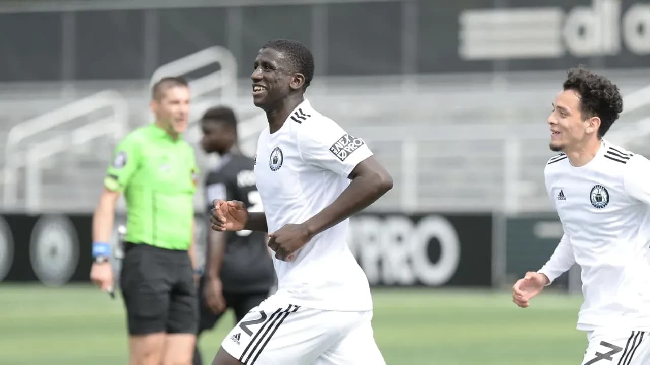 Players celebrating a goal during match