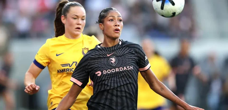 Angel City player controlling the ball during match