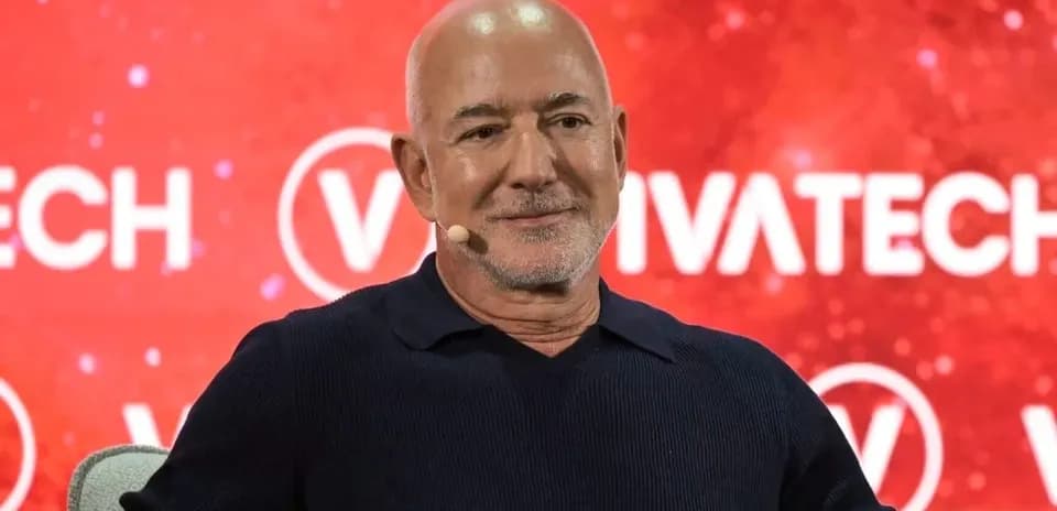 Speaker at VivaTech conference with red background