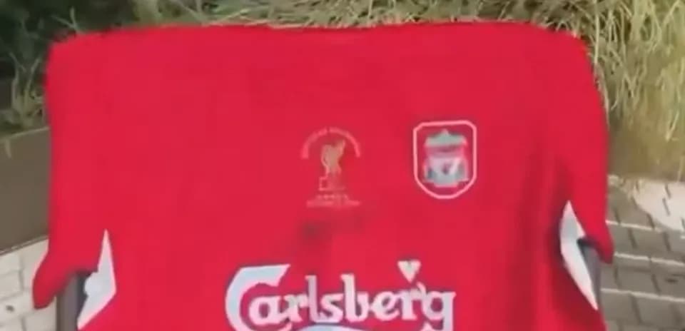 Red Liverpool jersey with Carlsberg logo displayed