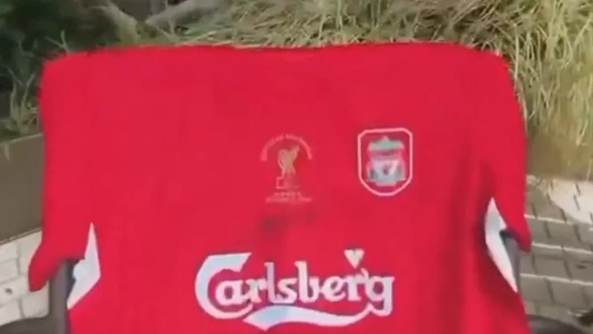 Red Liverpool jersey with Carlsberg logo displayed