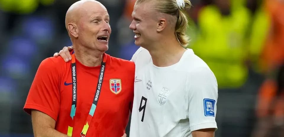Coach and player celebrating after a match