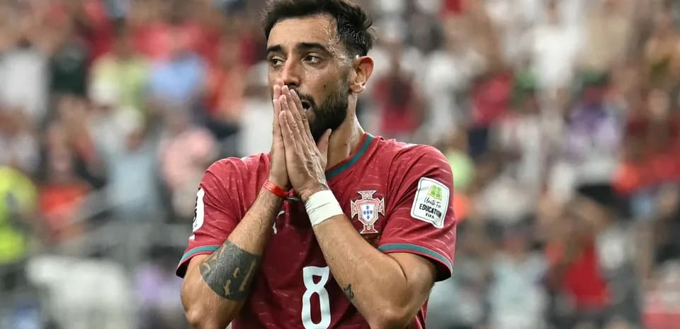 Player in Portugal jersey with hands on face