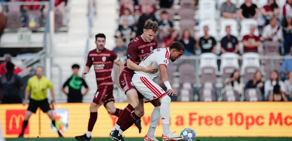 Players competing for the ball in USL match