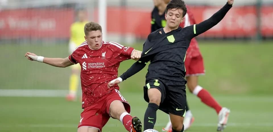 Two players contesting the ball during a match
