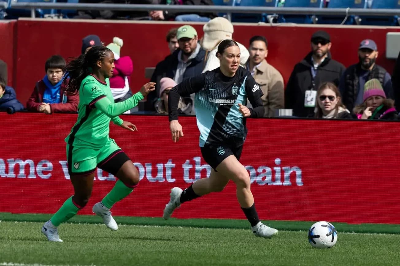 Player running with ball during NWSL match