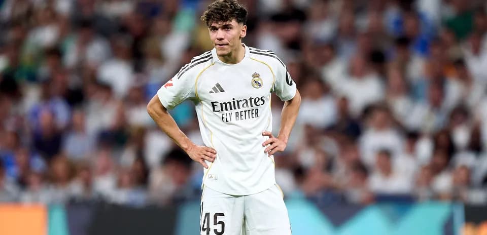 Real Madrid player standing on the field during match