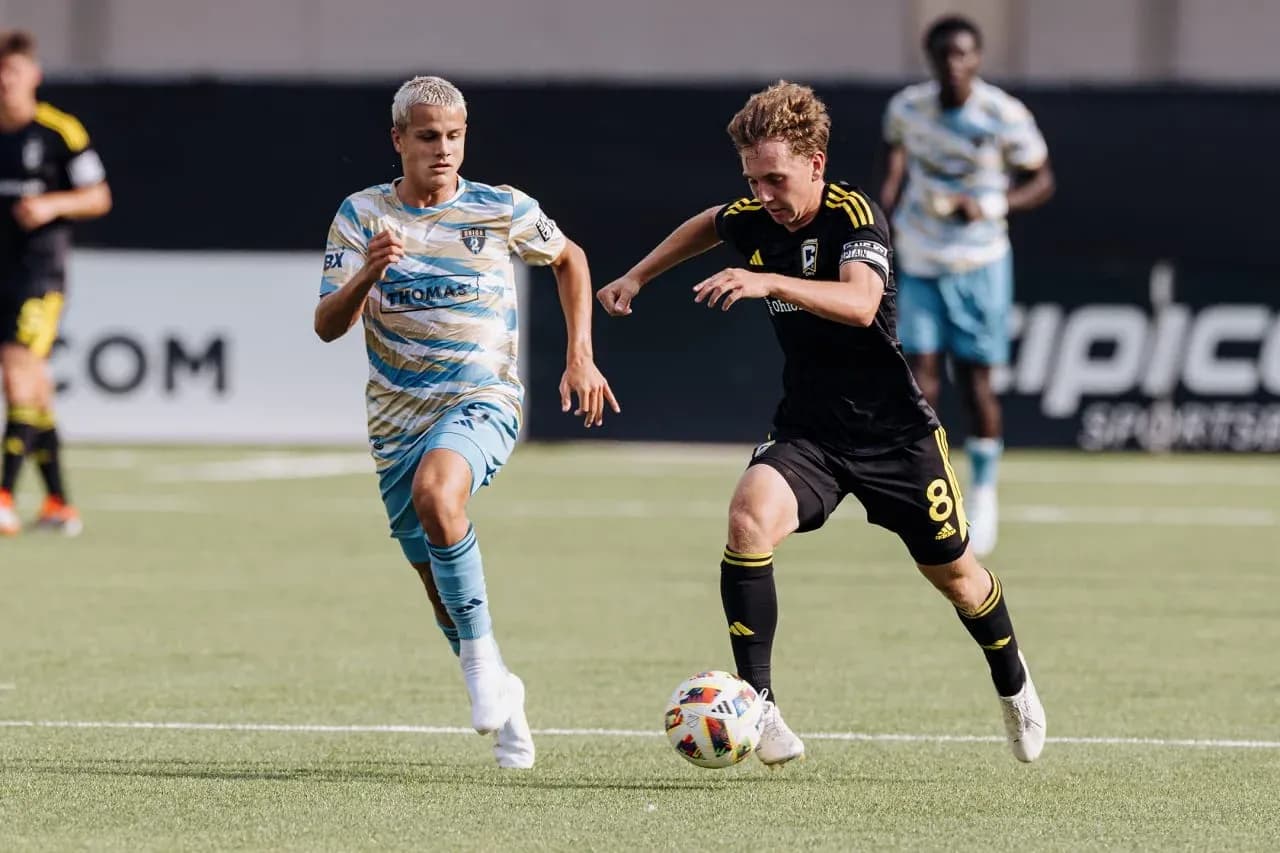 Columbus Crew II player dribbling past Philadelphia Union II opponent