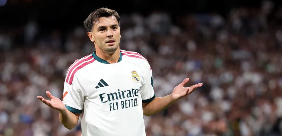 Player gesturing during match with crowd in background