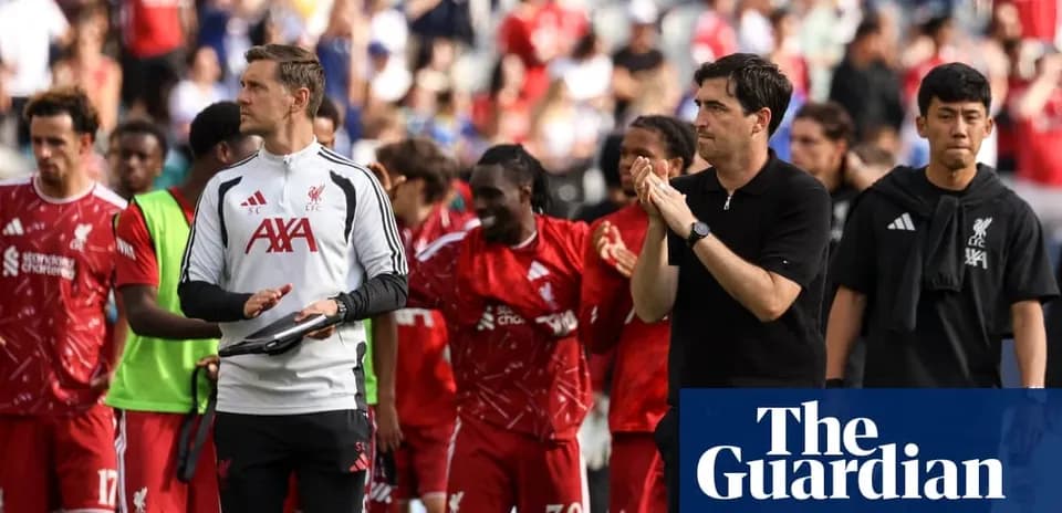 Liverpool players and staff celebrating after match