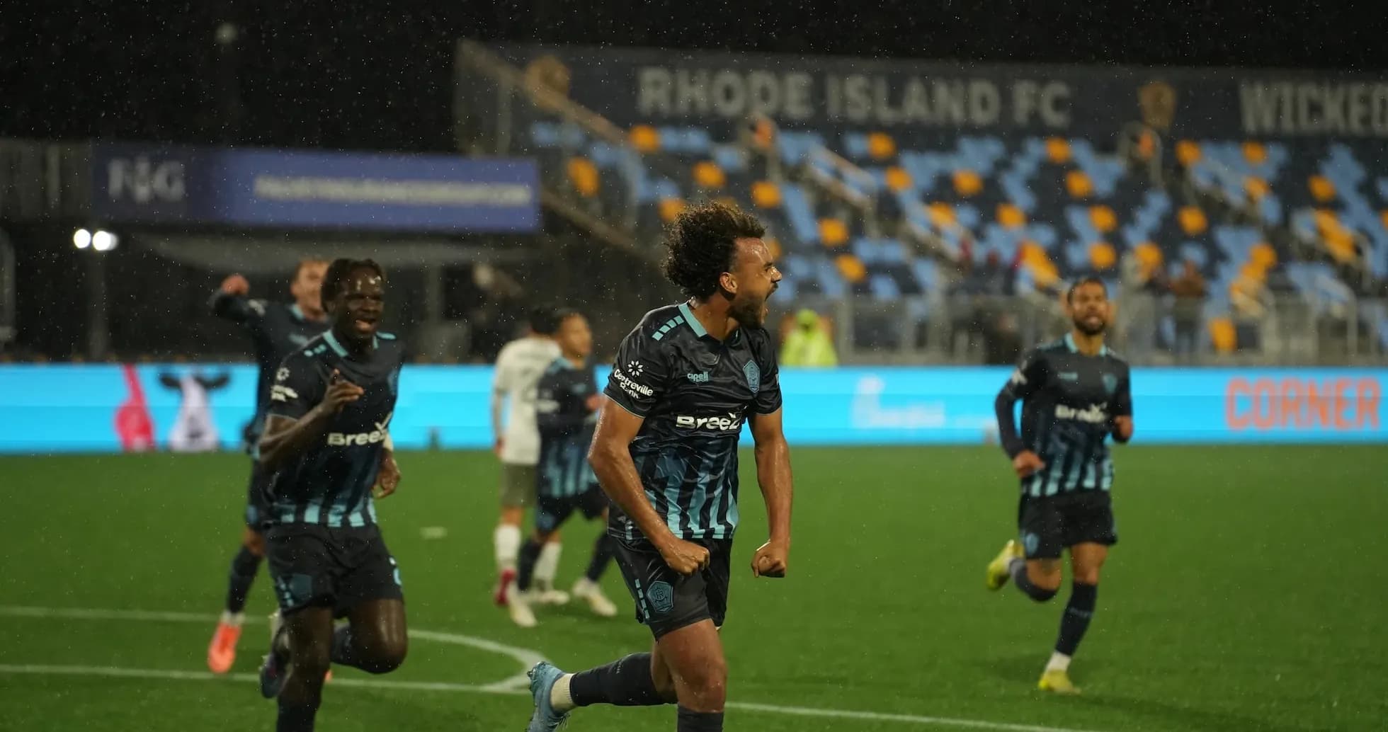 Rhode Island FC player celebrating during match