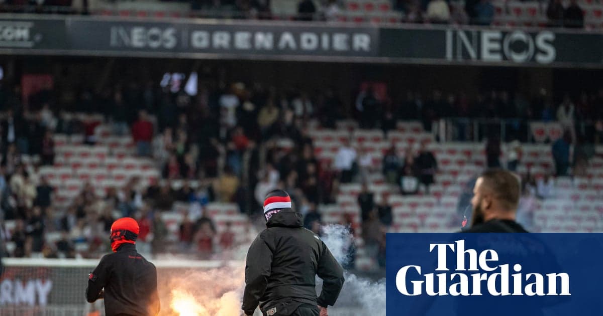 Fans setting off flares during a match