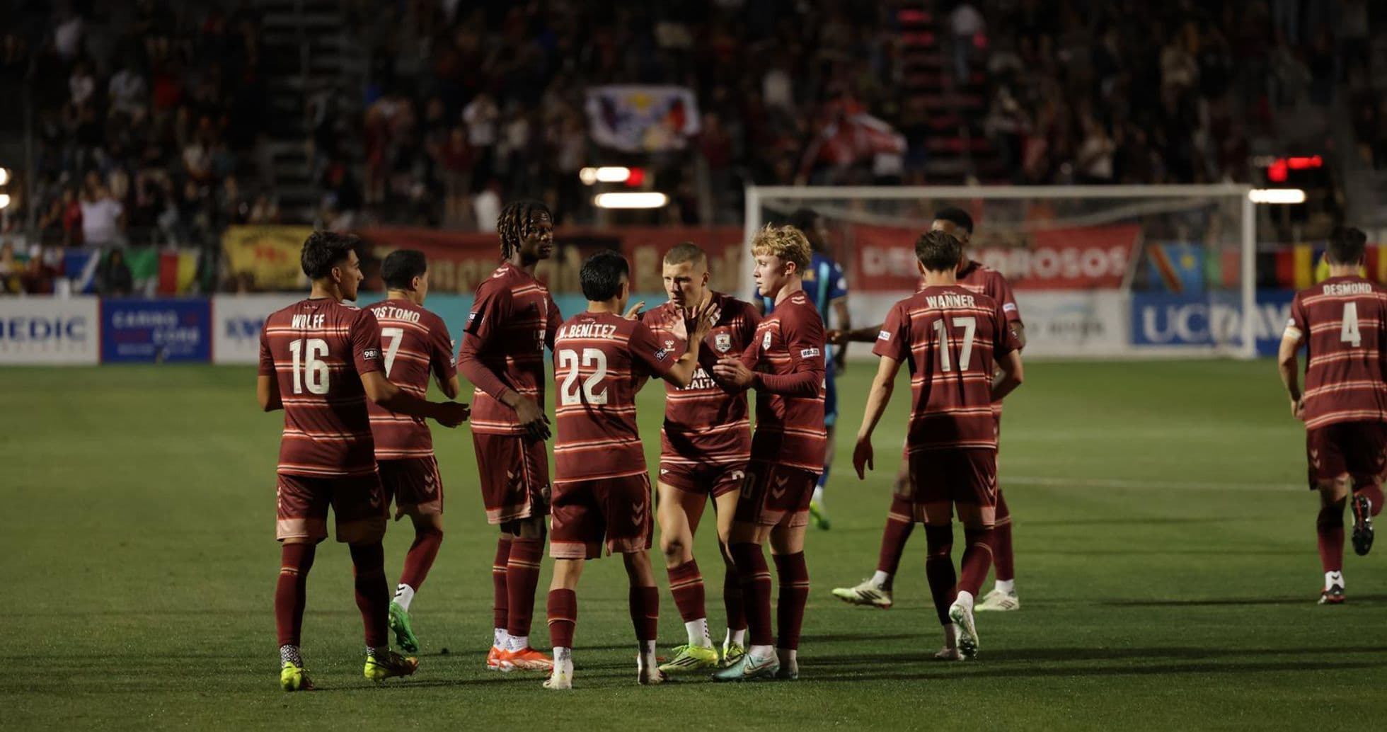 Players celebrating a goal during match