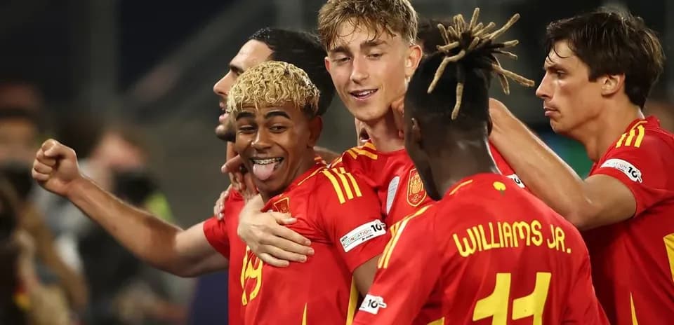 Spanish players celebrating a goal on the field