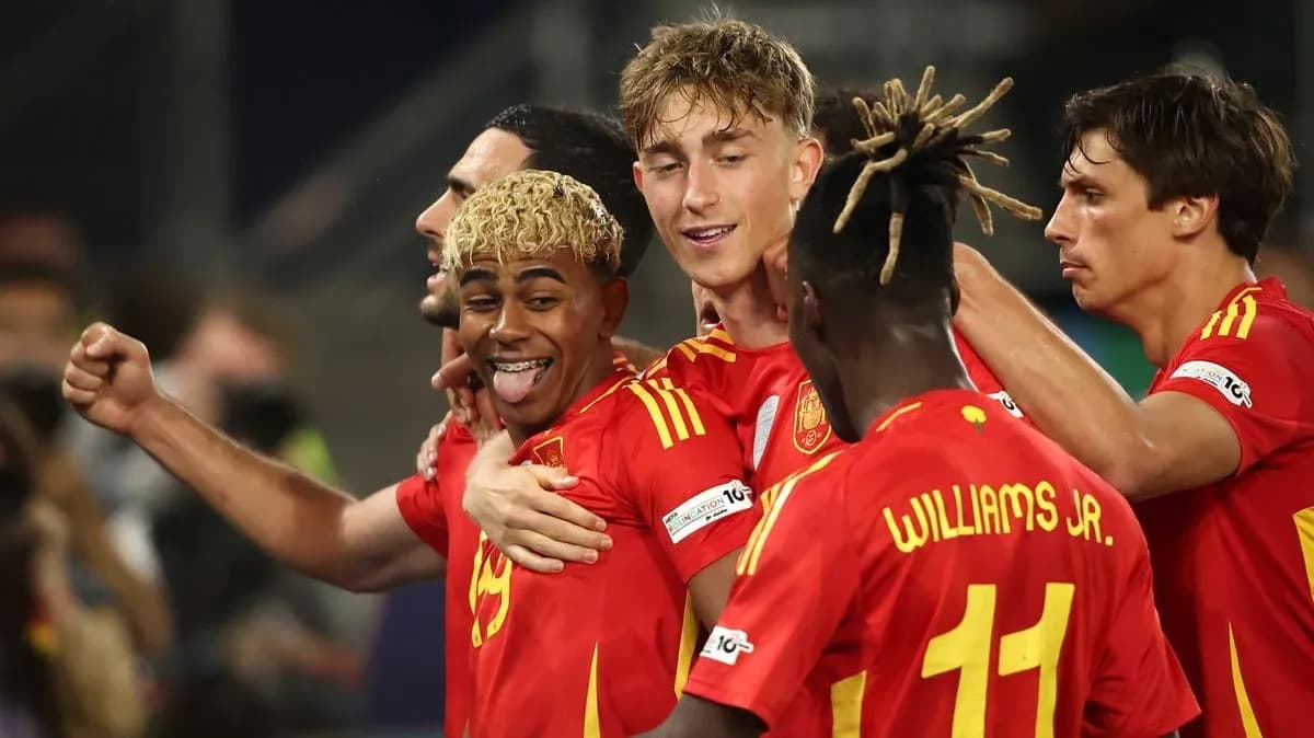 Spanish players celebrating a goal on the field