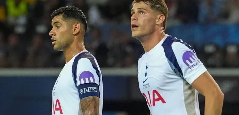 Two Tottenham players looking up during match