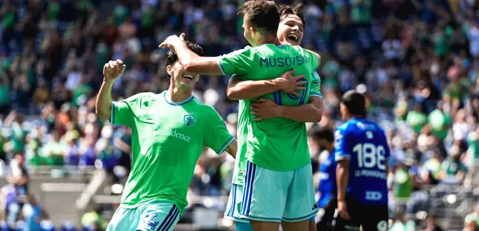 Seattle Sounders players celebrating a goal