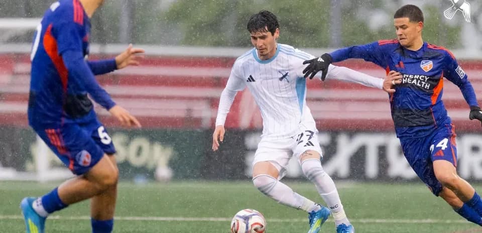 Player dribbling the ball during MLS Next Pro match