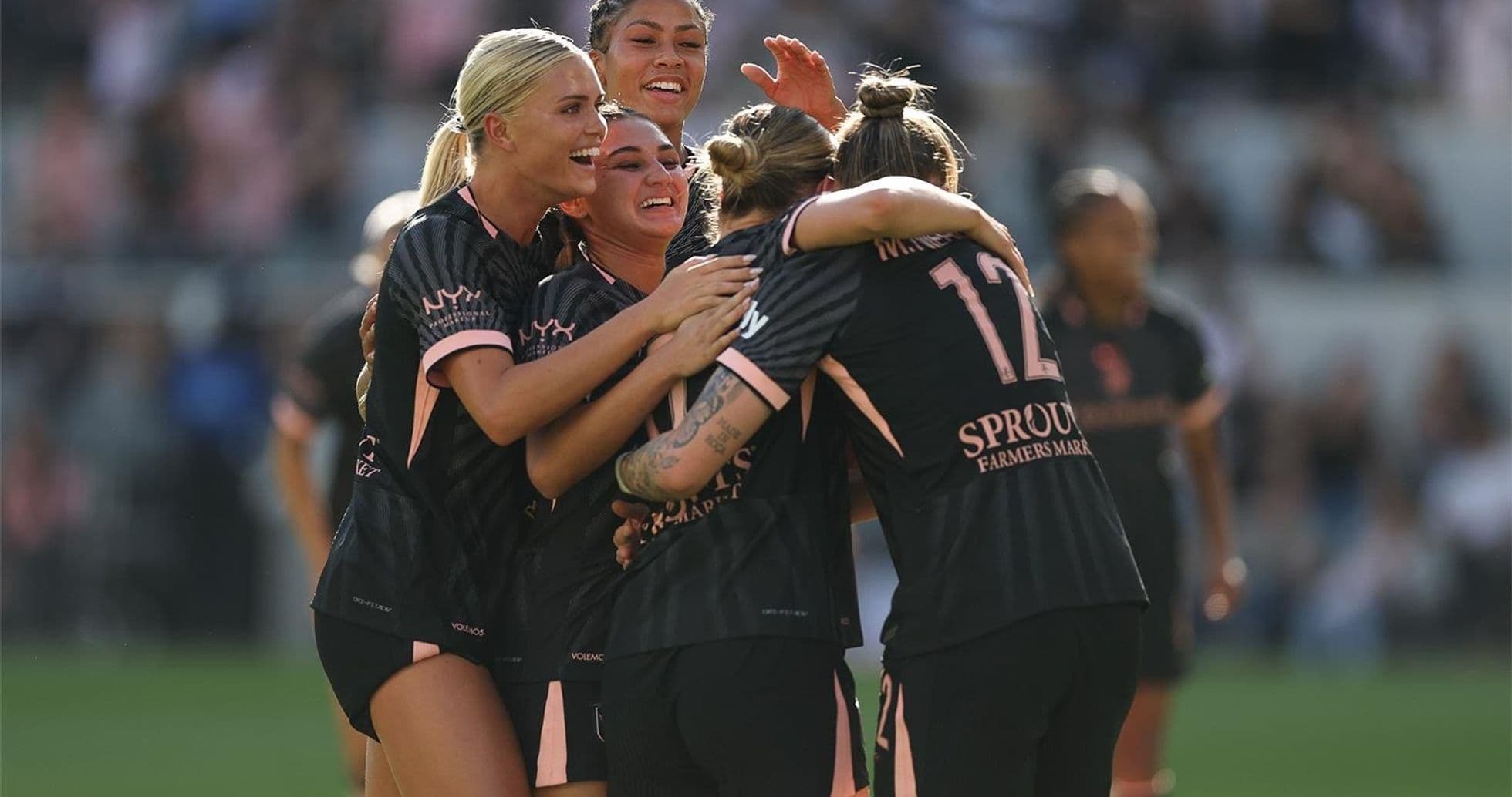 Players celebrating a goal during match