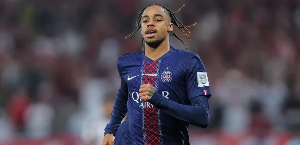 Player running in PSG kit during match