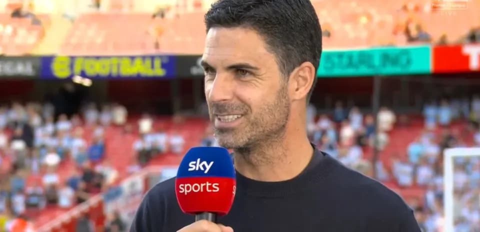 Coach speaking during pre-match interview on set
