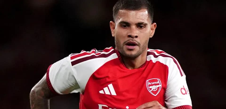 Player running during a match in Arsenal kit