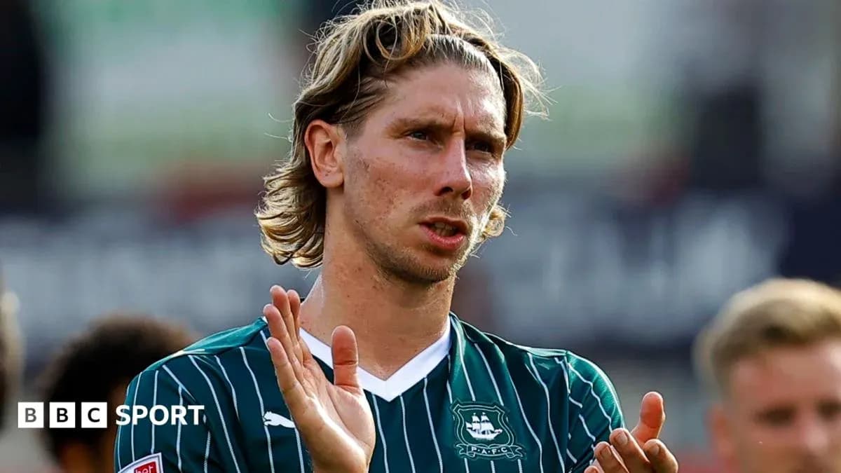 Player applauding fans after a match