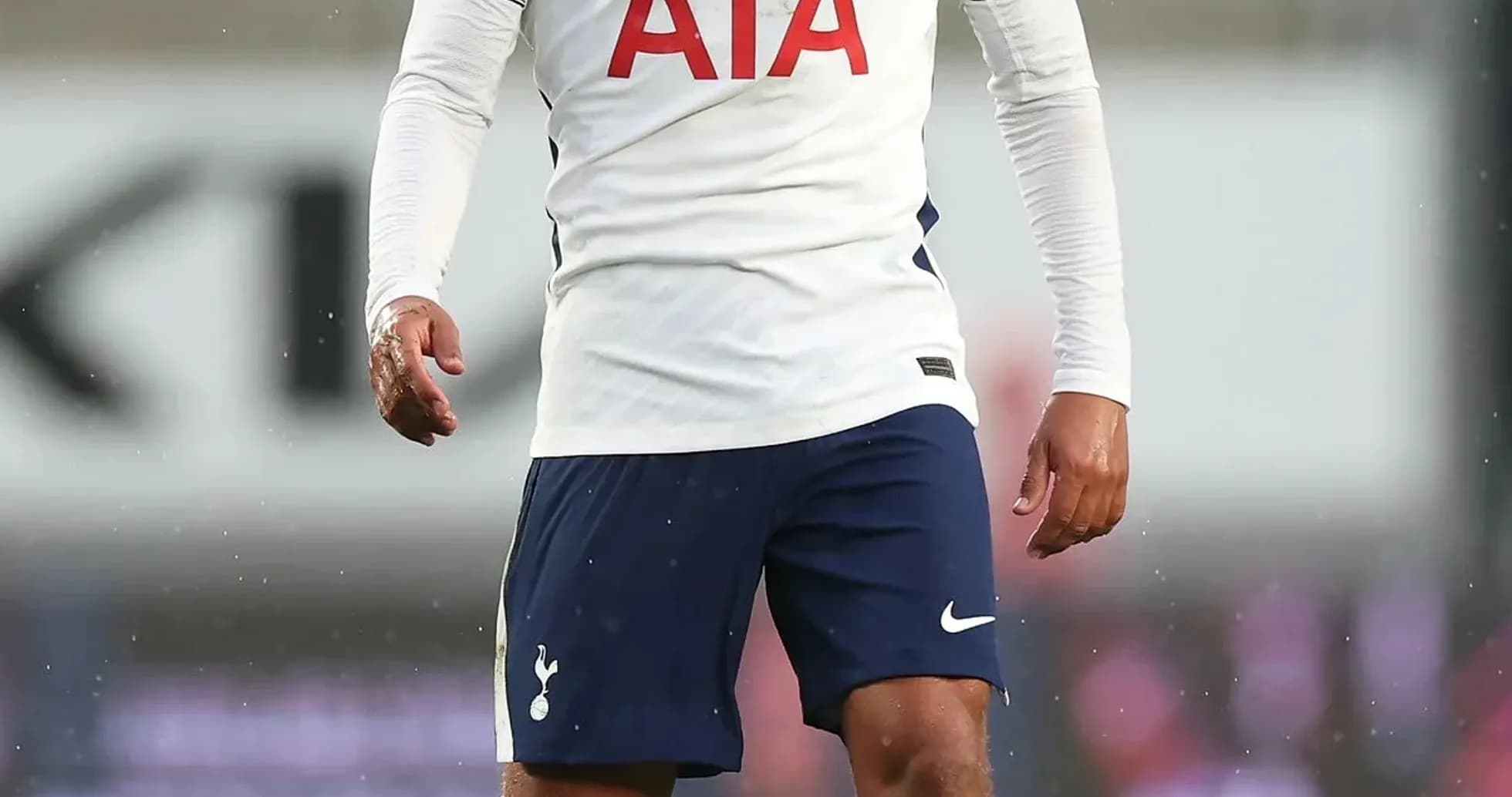 Player in Tottenham kit on the pitch during match