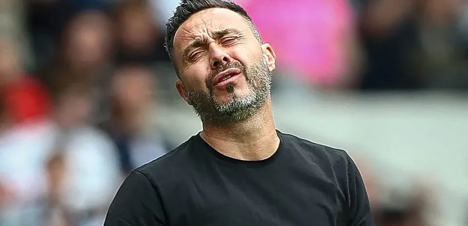 Coach reacting during a tense moment in match