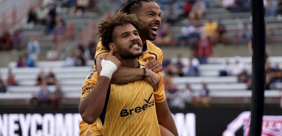 Two players celebrating a goal during match