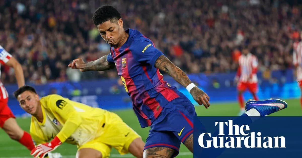 Barcelona player striking the ball against goalkeeper