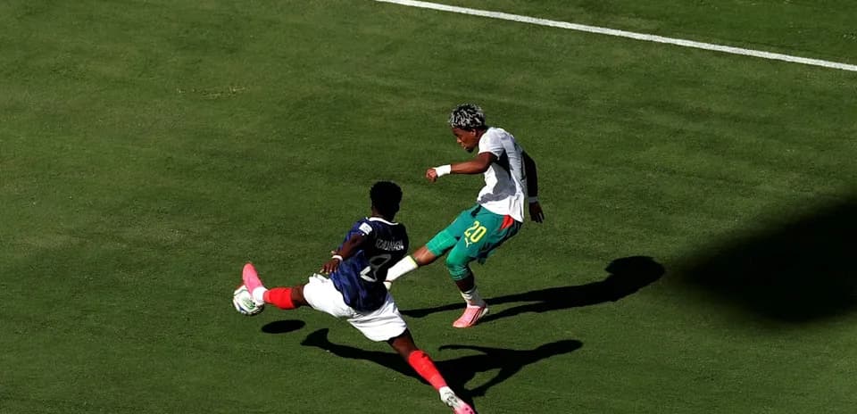 Player attempting to evade tackle during soccer match