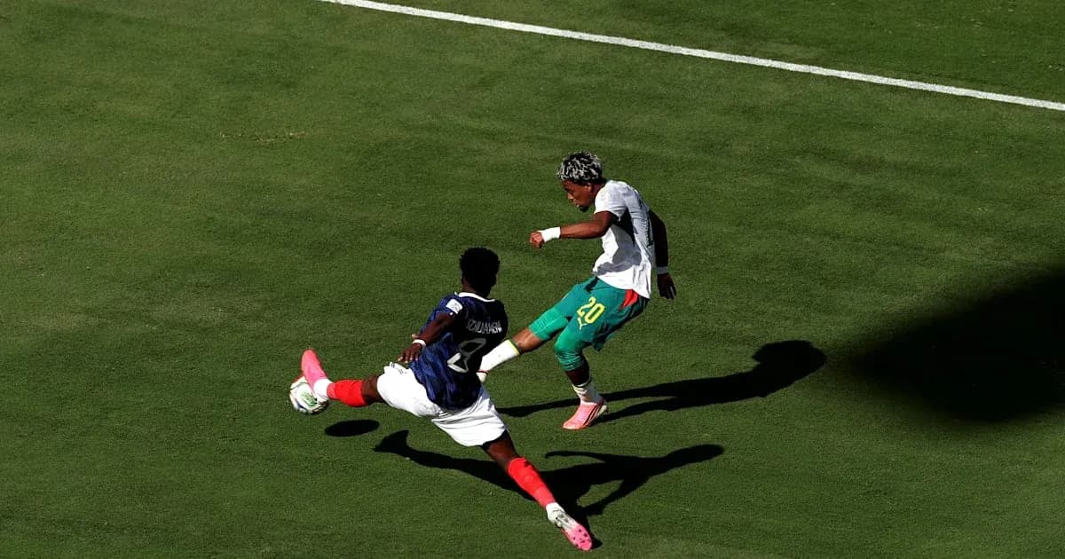 Player attempting to evade tackle during soccer match