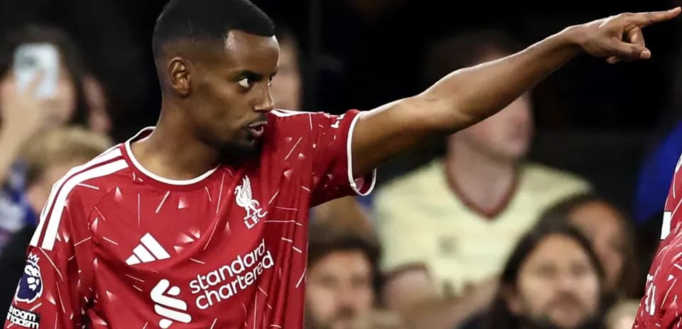 Player gesturing during Liverpool match action