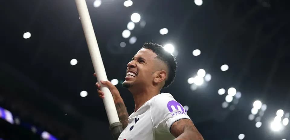 Player celebrating with a pole in stadium