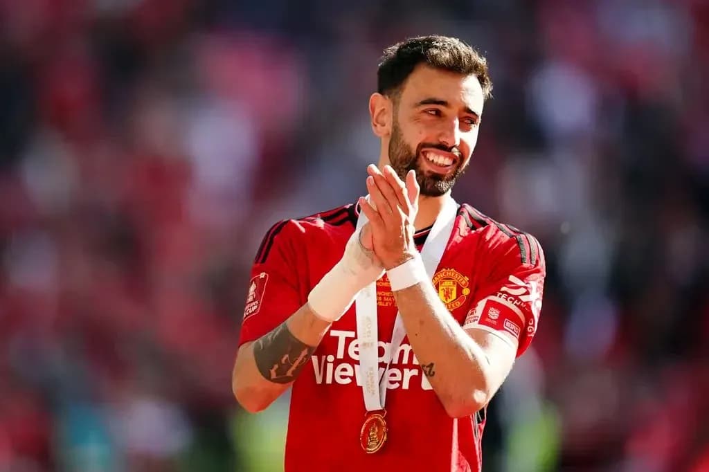 Bruno Fernandes celebrating with medal after match