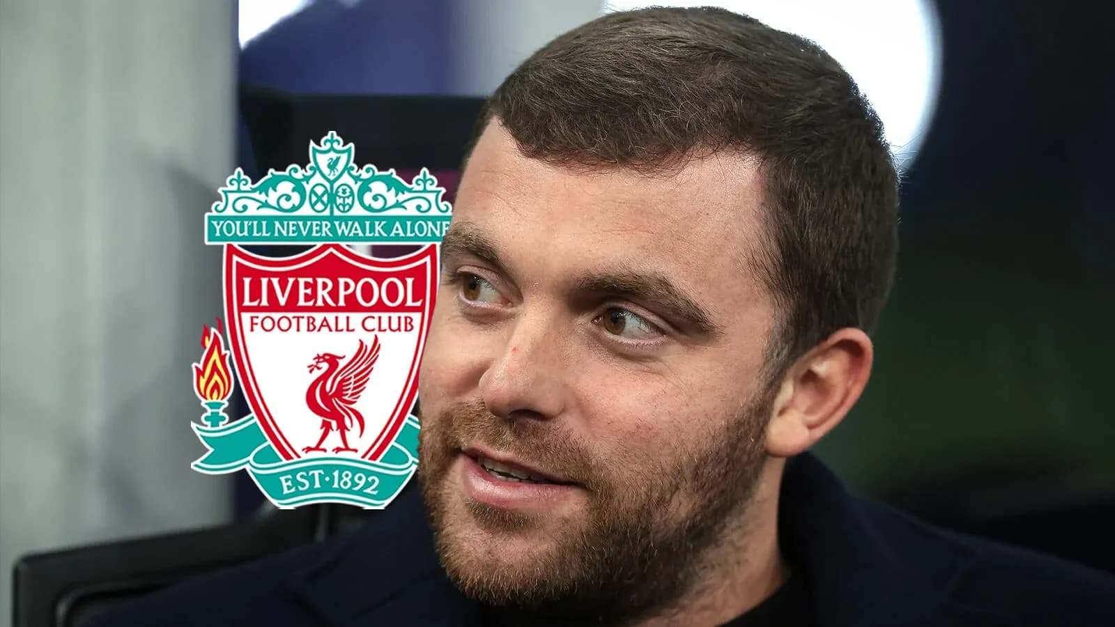 Close-up of a man with Liverpool FC logo