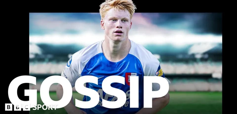 Player in blue and white kit on football field