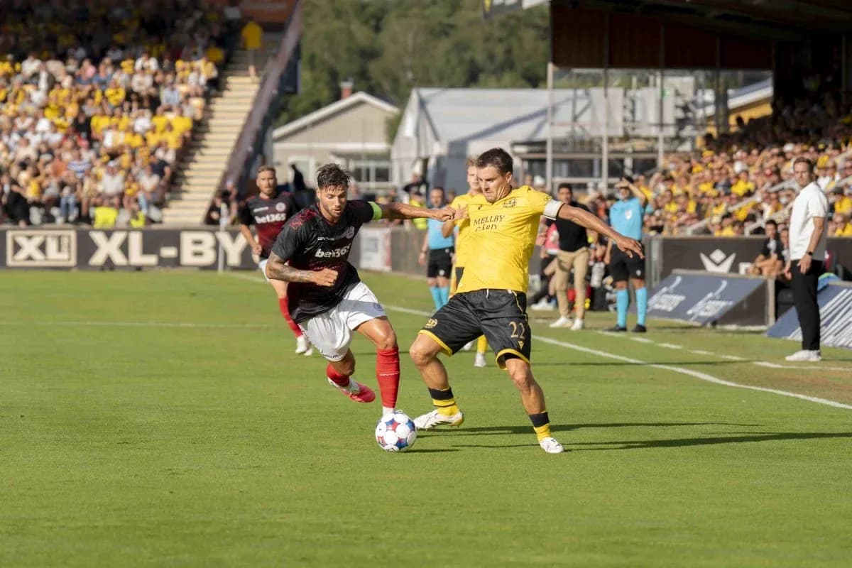 Players competing for the ball during match