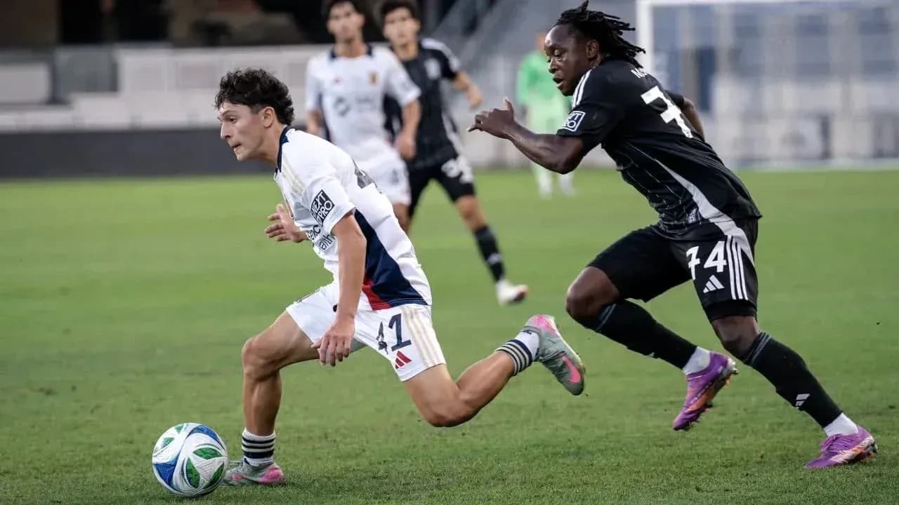 Player dribbling the ball during MLS Next Pro match