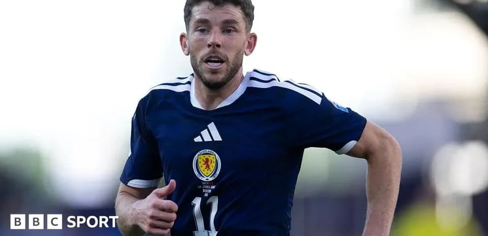 Player running during a football match for Scotland