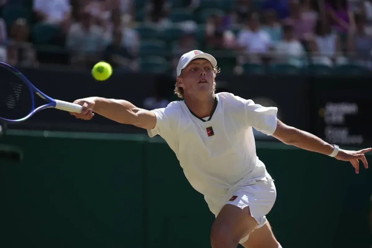 Player reaching for a tennis ball during match