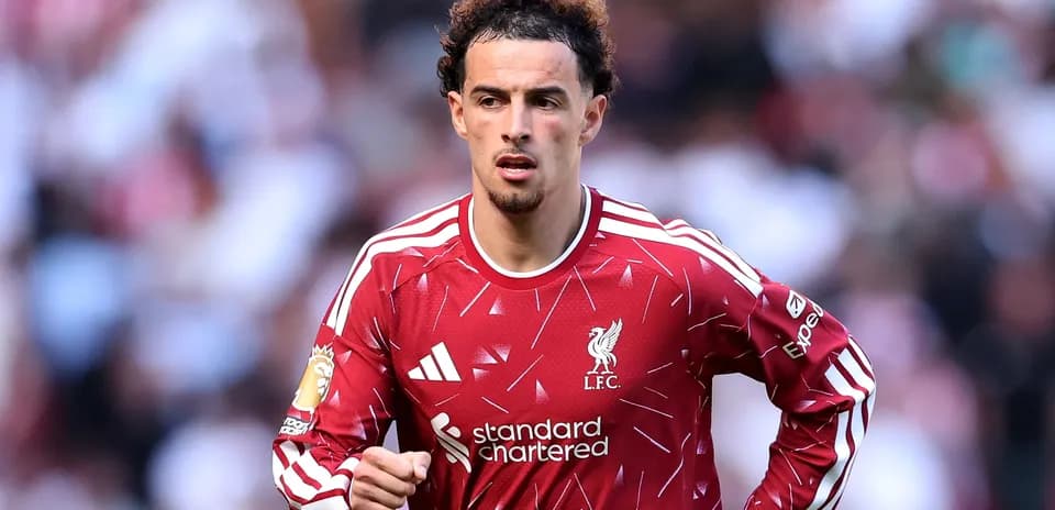 Player wearing Liverpool jersey during match