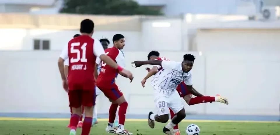 Player dribbling the ball during Al Dhafra vs Al Ain match