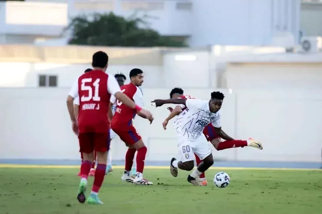 Player dribbling the ball during Al Dhafra vs Al Ain match