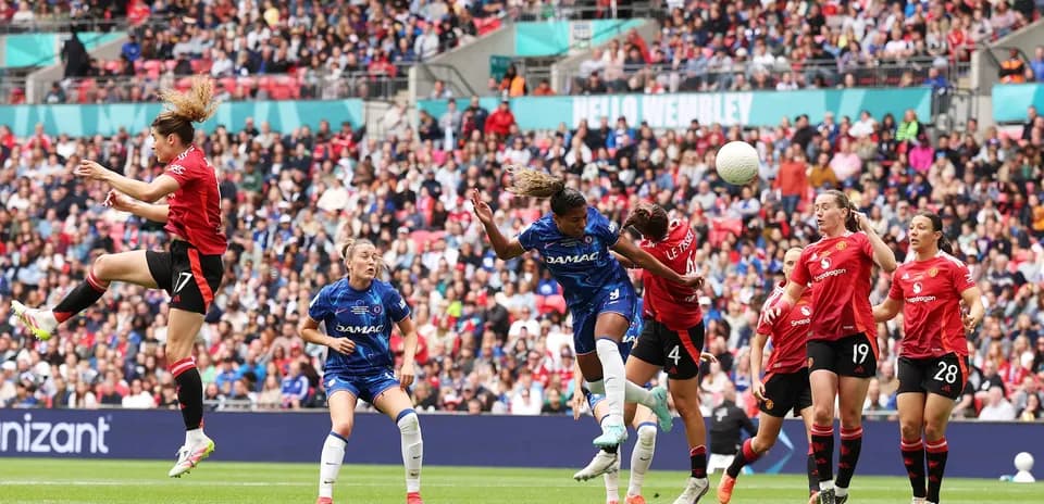 Chelsea and Manchester United players contesting for the ball