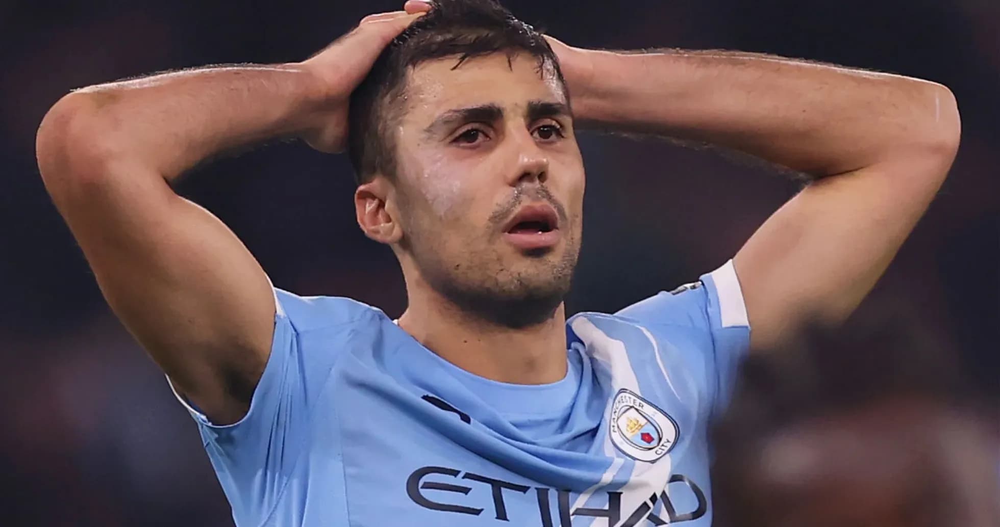 Player holding head in distress during match
