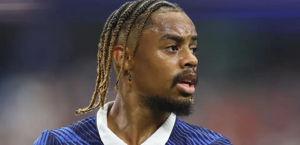 Player with braided hair during match action
