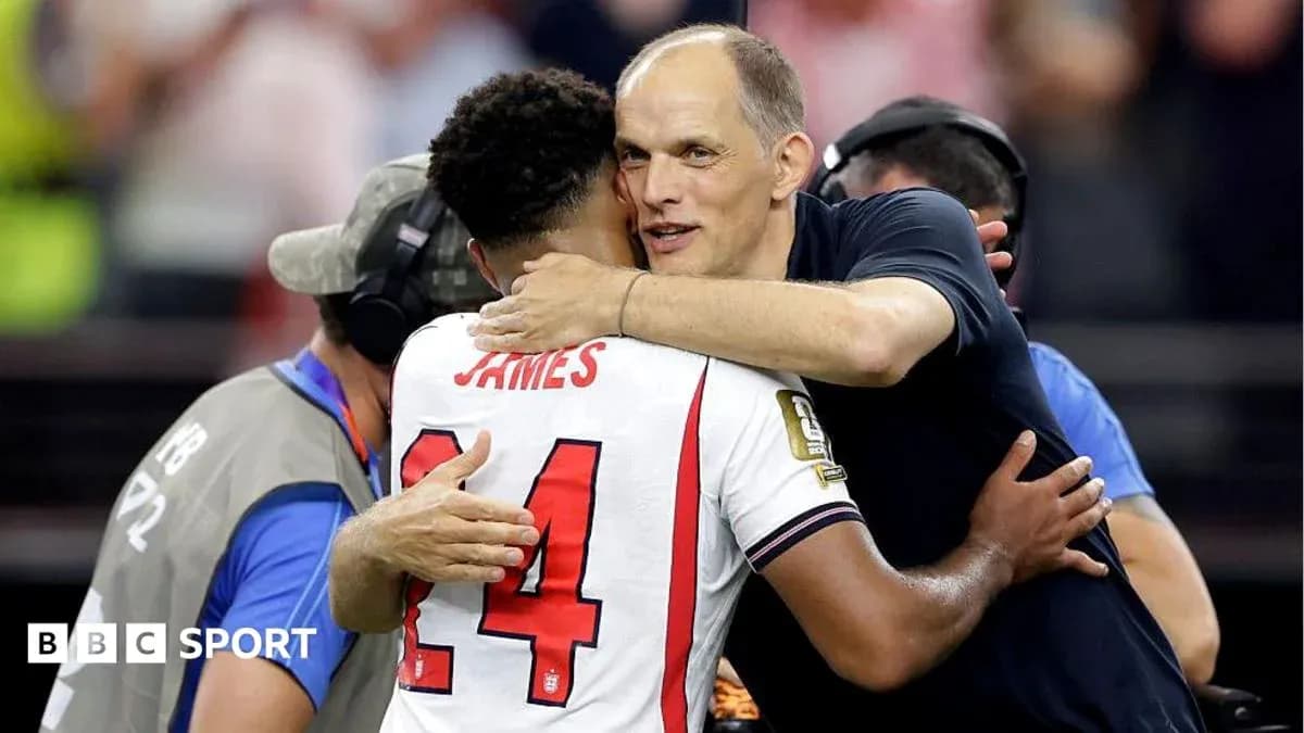 Player and coach embracing after match celebration