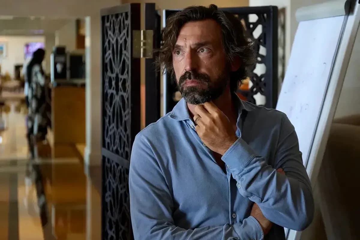 Man in blue shirt thinking in an indoor setting